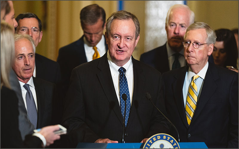 Sen. Crapo speaking behind podium