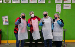 Four Cascadia Chapter members wearing masks on and aprons