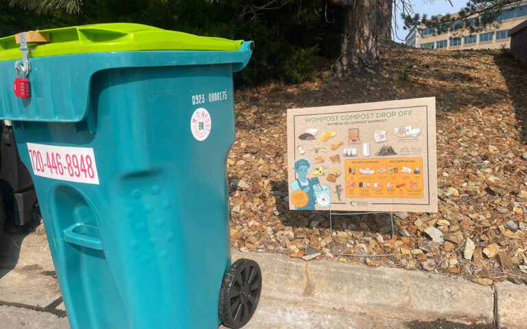 Wompost bin and sign
